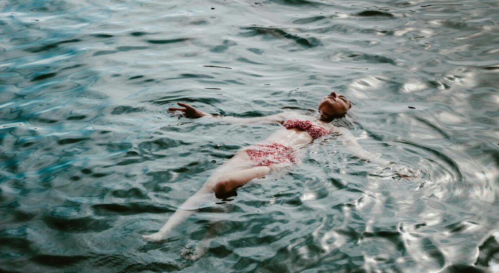 pexels-photo-27663879-27663879 A woman relaxes in a bikini, floating in a serene lake in Muğla, Türkiye.